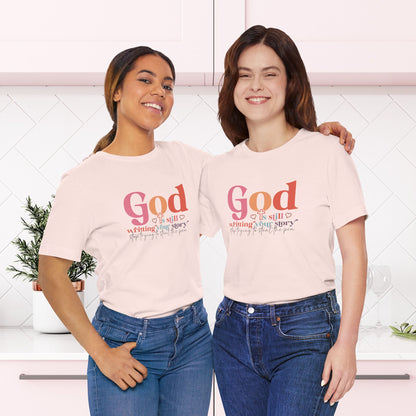 God Is Still Writing Your Story – Inspirational Christian T-Shirt | Unisex Jersey Short Sleeve Tee