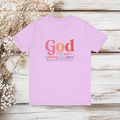 God Is Still Writing Your Story – Inspirational Christian T-Shirt | Unisex Jersey Short Sleeve Tee