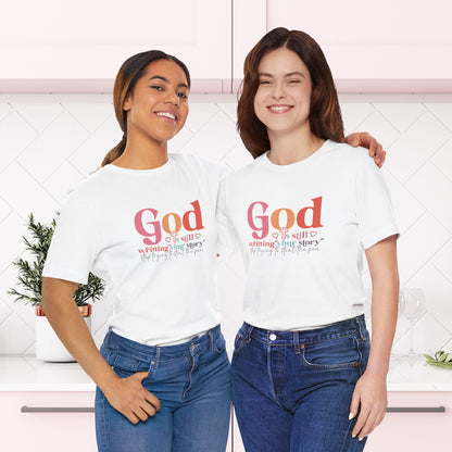 God Is Still Writing Your Story – Inspirational Christian T-Shirt | Unisex Jersey Short Sleeve Tee